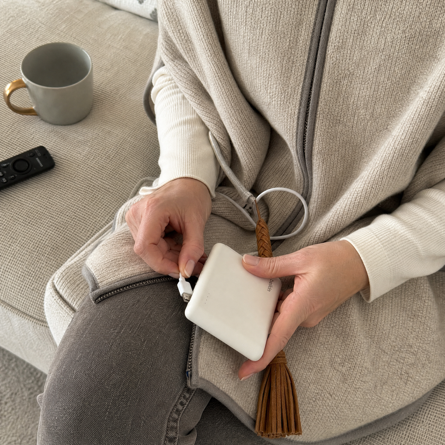 Plugging the USB cable into a power bank