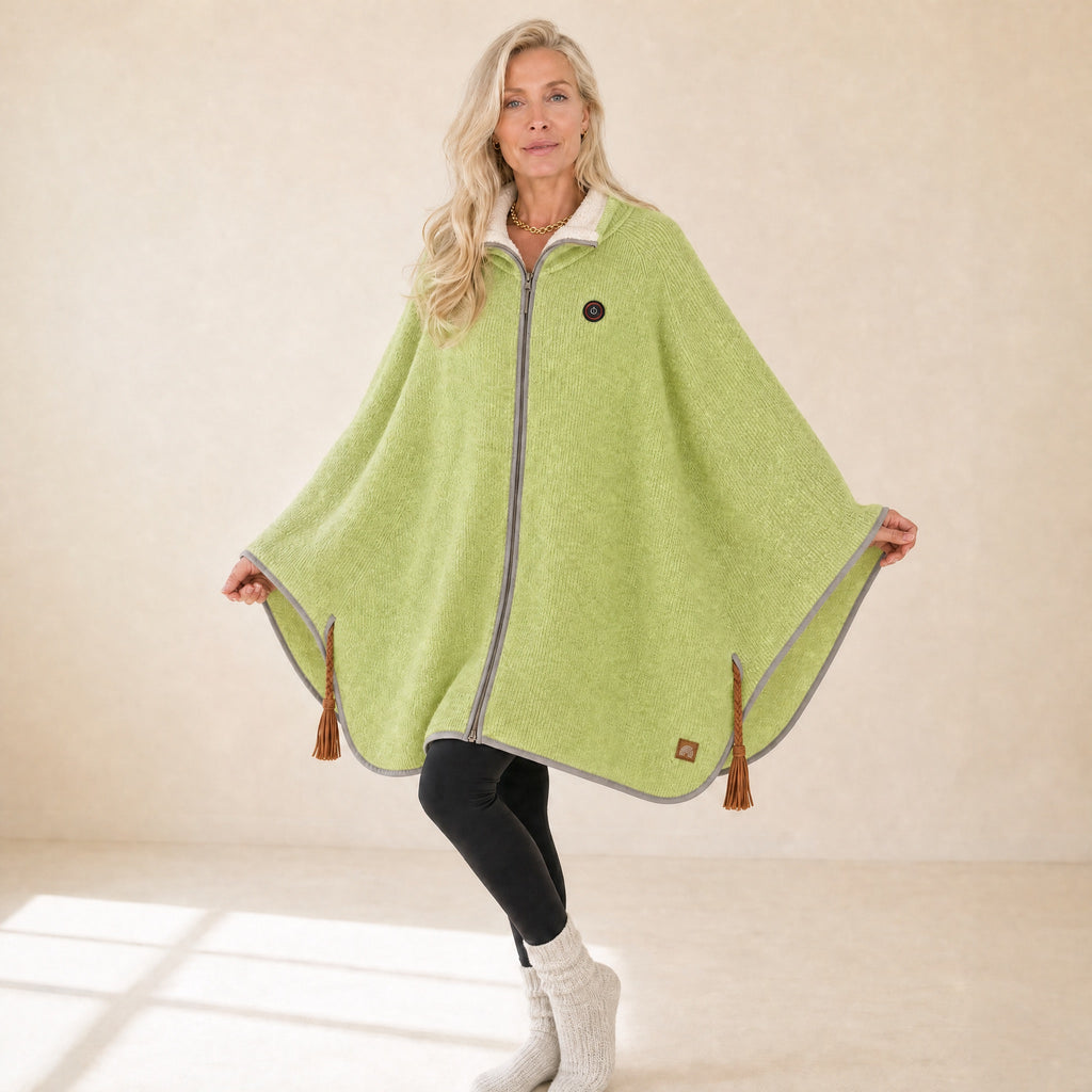 Woman wearing the green Snugloo heated cape with sherpa collar